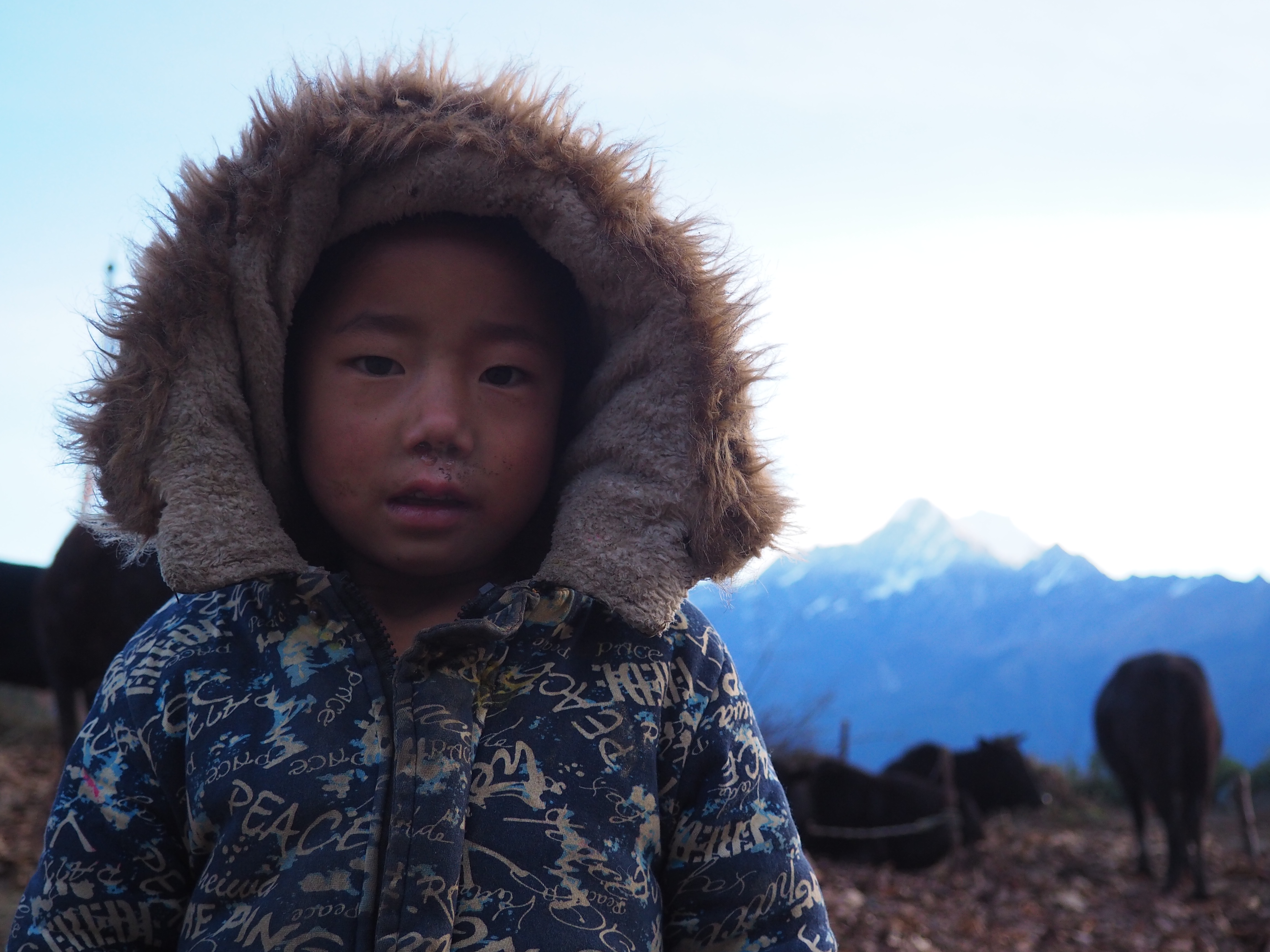 A young girl posing for a picture in the Himalayas